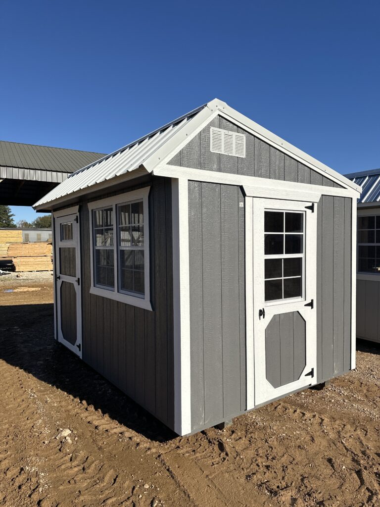 Delivery crew unloading portable shed